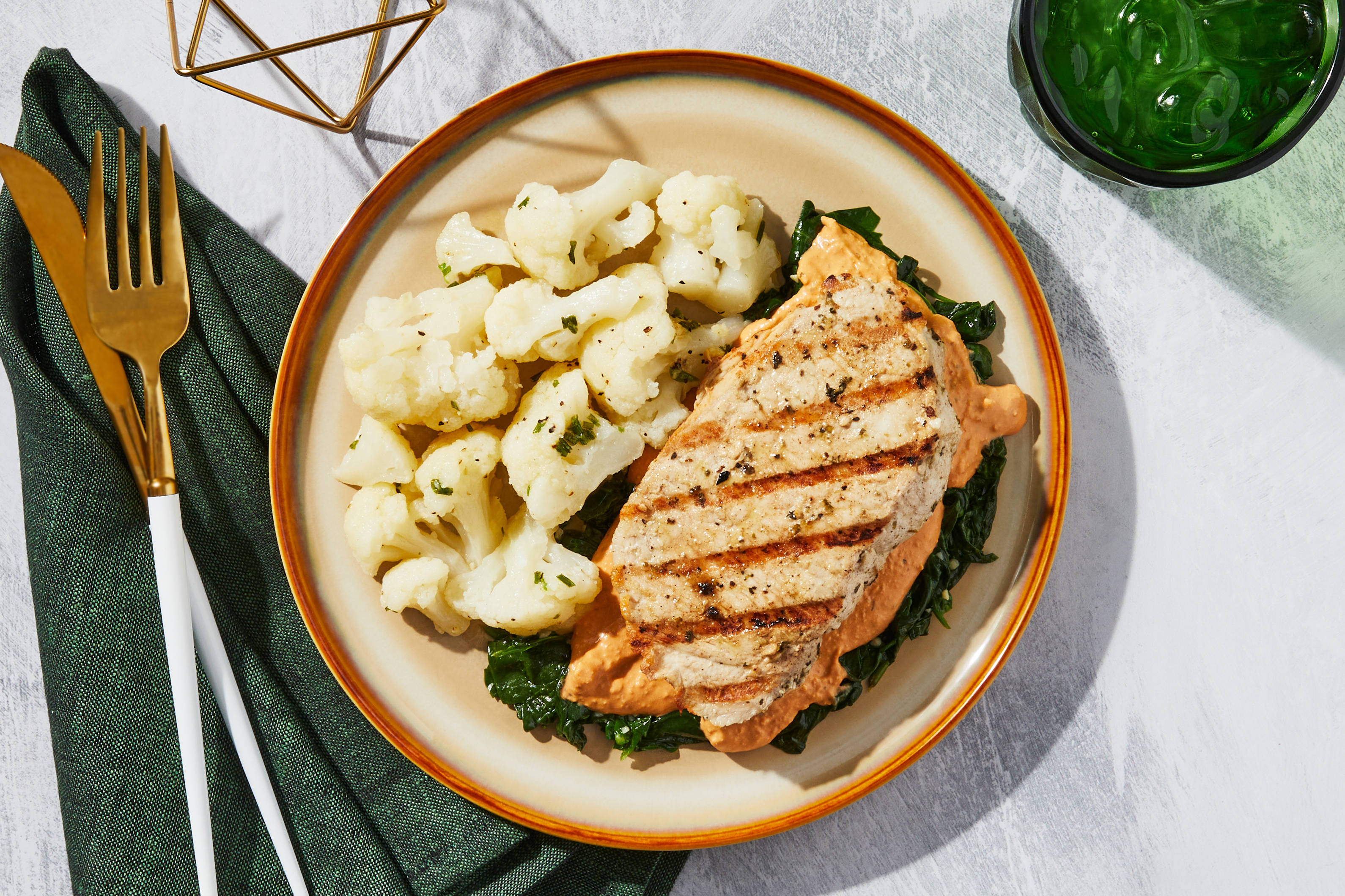 Creamy Tomato Pork Chop with Sautéed Spinach & Garlic-Chive
